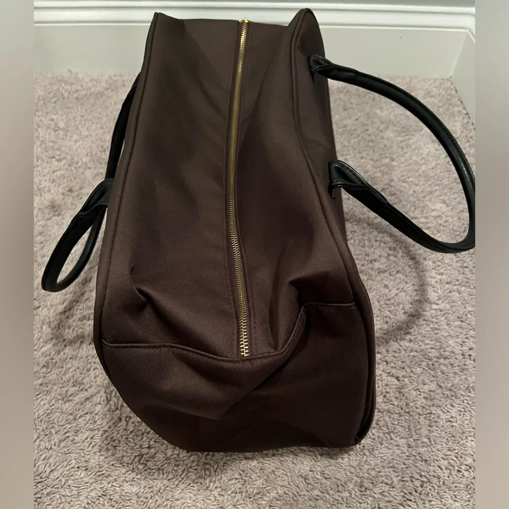 Million perfume brand duffle bag in brown